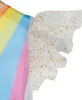 Close-up of a child's costume sleeve with rainbow colors and gold glitter. Anteprima dell’immagine prodotto