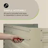 A hand is shown assembling a metal raised garden bed with a screwdriver. Text overlays describe simple assembly. Podgląd zdjęcia produktu