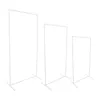 Three white metal stands of varying heights against a white background. Voir les images du produit