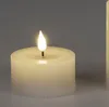 A close-up shot of a cream-colored LED candle with a ribbed texture and a lit flame. Produktbild-Vorschau