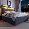 A bedroom scene at night with a bed and a city view outside the window. Anteprima dell’immagine prodotto