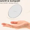 A hand is holding a wireless charger, with text indicating it is lightweight and compact. Produktbild-Vorschau