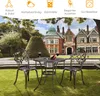 A bistro set with two chairs and a table is placed on a lawn in front of a large, ornate building. Náhľad obrázku produktu