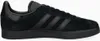 A side view of a black Adidas Gazelle sneaker. Voir les images du produit