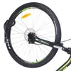 A close-up view of a bicycle wheel and part of the frame, mounted on a wall bracket. Náhled obrázku produktu
