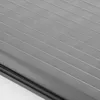 A close-up view of a gray pleated blind with horizontal lines. Produktbild-Vorschau