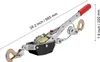 A manual cable puller winch with two hooks and a red handle, shown against a white background with dimensions indicated. Anteprima dell’immagine prodotto