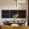 A dining table setting with upholstered wall panels behind it. Anteprima dell’immagine prodotto