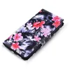 A floral patterned flip case for a mobile phone, shown at an angle on a white background. Produktbild-Vorschau