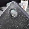 Close-up of a black speckled cutting board with a hole for hanging. Náhľad obrázku produktu
