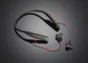 A pair of black neckband headphones with red accents is shown on a reflective black surface. Voir les images du produit