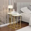 A bedroom scene with two nesting side tables next to a bed. Náhled obrázku produktu