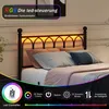 A bed with LED lighting in the headboard, with a remote control and feature icons displayed below. Produktbild-Vorschau