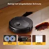 A black robot vacuum cleaner is cleaning a spill on a wooden floor. Produktbild-Vorschau