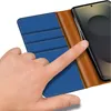 A hand is shown interacting with a blue and brown flip case for a smartphone. Anteprima dell’immagine prodotto