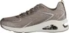 Side view of a beige sneaker with glitter accents. Voir les images du produit