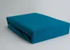 A folded teal fitted sheet on a light gray background. Produktbild-Vorschau