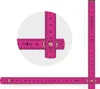 A pink folding ruler is shown in an L-shape, with a close-up inset highlighting the measurement markings. Anteprima dell’immagine prodotto