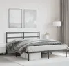 A bedroom scene with a metal bed frame, bedding, and wall art. Náhľad obrázku produktu