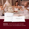 A family is having a pillow fight in bed. Voir les images du produit
