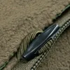A close-up view of a zipper pull on a brown, fuzzy blanket. Náhľad obrázku produktu