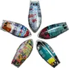 Five colorful, boat-shaped objects arranged in a circular pattern against a white background. Produktbild-Vorschau