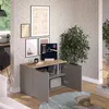 A modern living room setting with a small cabinet, artwork, and a plant. Produktbild-Vorschau