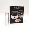 The image shows the packaging of a Krups egg cooker, with the product itself partially visible on the box. Voir les images du produit