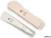 A tube of eye serum and its packaging box are placed on a white background. Voir les images du produit