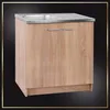 A kitchen cabinet with a sink and faucet, presented against a dark background with a decorative border. Voir les images du produit