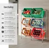 A metal shelving unit with colorful crates filled with produce and beverages, set against a light gray and white background. Náhled obrázku produktu
