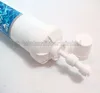 A close-up shot of a white water filter cartridge with a blue label and a detached white cap. Náhľad obrázku produktu