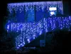 A house decorated with blue icicle lights for Christmas. Náhľad obrázku produktu