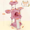 A pink cat tree with multiple levels, perches, a condo, and a scratching ramp, with dimensions indicated by measurement lines and text. Podgląd zdjęcia produktu