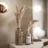 A vanity table setup with decorative elements and lighting. Náhled obrázku produktu