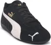 A black Puma Speedcat OG shoe with a white stripe and gold Puma logo. Voir les images du produit