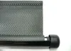 A close-up of a black roller blind with a perforated pattern, attached to a black rod with a black end cap. Podgląd zdjęcia produktu
