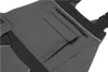 A close-up view of the pocket and zipper area of a pair of gray overalls. Produktbild-Vorschau
