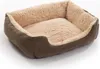 A brown and beige dog bed on a white background. Produktbild-Vorschau