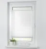 A white pleated blind is installed in a white window frame. A potted plant and three white cups are on the windowsill. Produktbild-Vorschau
