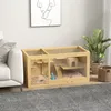 A hamster cage is placed on a rug next to a sofa and a plant. Náhled obrázku produktu