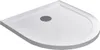 A white shower tray with a circular drain in the center, viewed from a diagonal angle. Produktbild-Vorschau