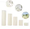 Collage of product images showing white cylindrical stands with floral arrangements in various settings. Podgląd zdjęcia produktu