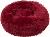 A round, plush dog bed in a burgundy color. Náhled obrázku produktu