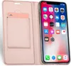 A pink flip case for an iPhone is shown open, with the phone inside. The case has a slot for a card. Produktbild-Vorschau
