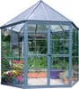 A hexagonal greenhouse filled with plants and flowers. Voir les images du produit