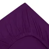 A close-up view of a purple fitted sheet, showing the elasticized edge and fabric texture. Produktbild-Vorschau