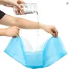 A person is pouring liquid onto a pet hygiene pad. Produktbild-Vorschau