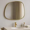 A bathroom sink area with a mirror, faucet, and soap dispenser. Podgląd zdjęcia produktu