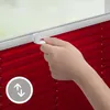 A hand is shown adjusting a red pleated blind. Produktbild-Vorschau